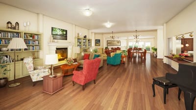 Bright common area with colorful seating and bookshelves