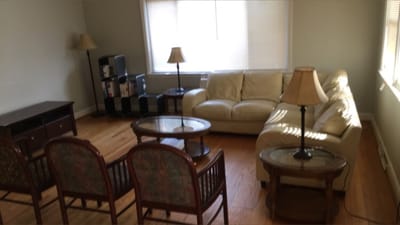 Bright common area with seating and lamps