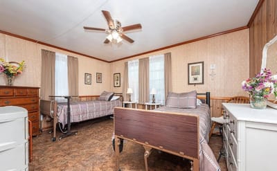 Cozy shared resident room with two beds and decor