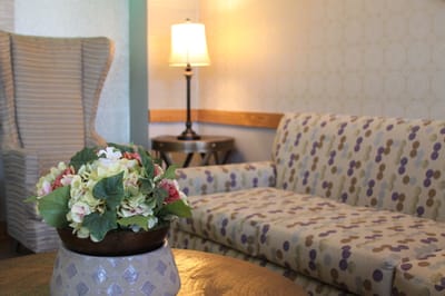 Interior view of a cozy seating area with flowers