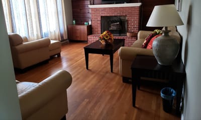 Cozy common area with seating and a fireplace
