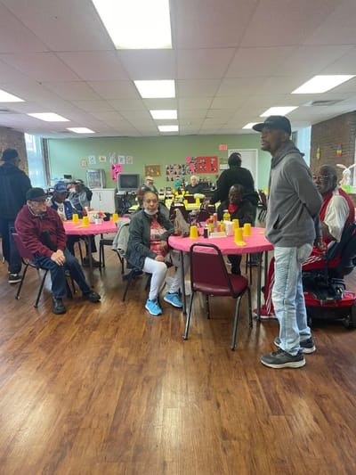 Residents engaged in an activity in a community room