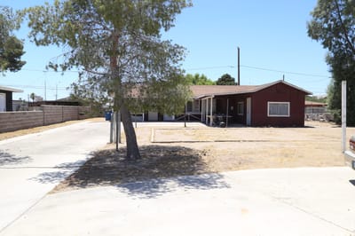 Exterior view of the facility building surrounded by trees