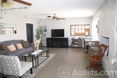 Common area with seating and TV in the facility