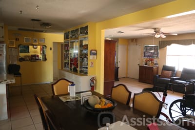 Interior common area with dining table and wheelchair