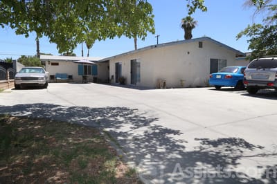 Lake Mead Care Home, assisted living in Las Vegas, NV — Parking area with cars and palm trees