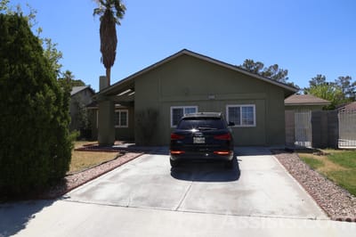 Exterior view of a senior care facility with a driveway