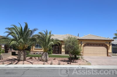 Martha’s House Senior Living, assisted living in Las Vegas, NV — Single-story building with palm trees and landscaped front yard