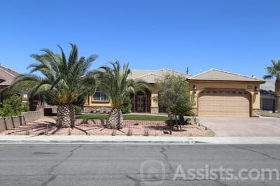 Martha’s House Senior Living, assisted living in Las Vegas, NV — Single-story house with palm trees and landscaped yard