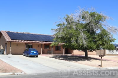As Time Goes By, assisted living in Las Vegas, NV — Residential home with solar panels and large tree