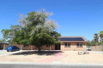 Exterior view of a senior living facility with landscaping