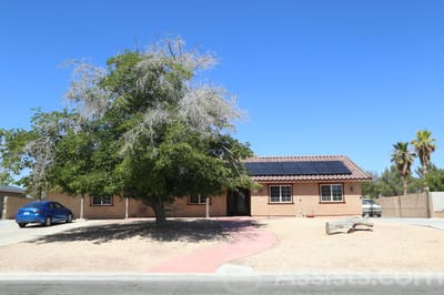 Exterior view of a senior living facility with landscaping