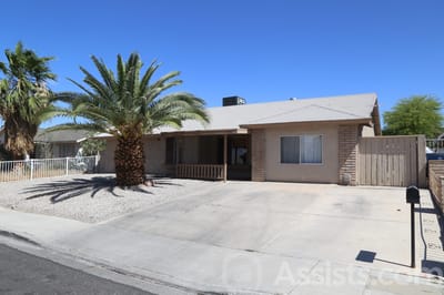 Prime Care Facilities, assisted living in Las Vegas, NV — Single-story house with palm trees and driveway