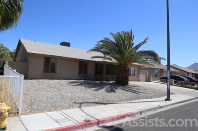 Prime Care Facilities, assisted living in Las Vegas, NV — Single-story building with palm trees and gravel landscaping