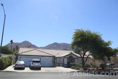 Exterior view of a facility with mountains in the background