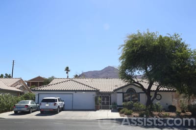 Front view of the assisted living facility with mountain in background