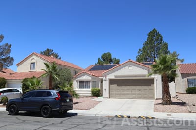 Beachport Villa, assisted living in Las Vegas, NV — Single-family home with palm trees and a driveway