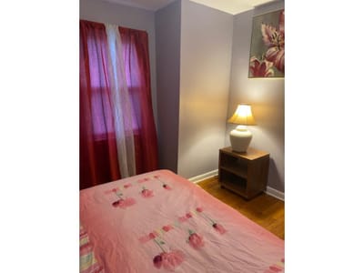 Cozy resident room with floral decor and lamp