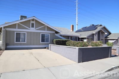 Theresiane Adult Group Care, assisted living in Las Vegas, NV — Senior living facility with landscaped front yard and driveways