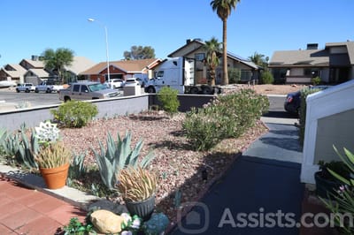Theresiane Adult Group Care, assisted living in Las Vegas, NV — Landscaped pathway leading to a residential area