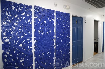 We Care Residential Home, assisted living in Las Vegas, NV — Blue decorative wall panels in a hallway of a facility