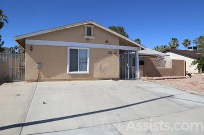 Gentle Spring Care Home, assisted living in Las Vegas, NV — Single-story residential building with a fenced entrance