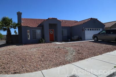 Ross Senior Residence, assisted living in Las Vegas, NV — Single-story house with a red door and driveway
