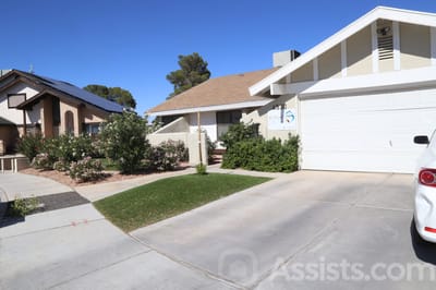 Exterior view of a residential building with landscaping