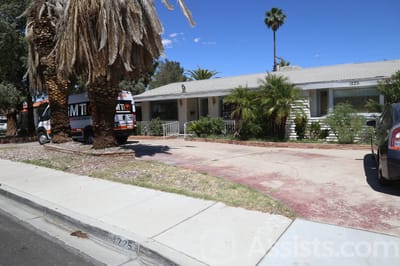 Mothers Best Care For the Elderly, assisted living in Las Vegas, NV — Senior living facility exterior with palm trees and driveway