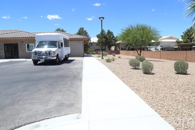 Facility transport van parked near the building