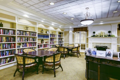 A cozy library area with bookshelves and seating