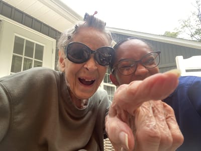 Residents enjoying time outdoors, smiling and posing