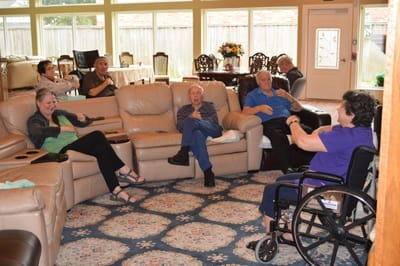 Residents engaging in conversation in a common area