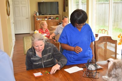 Staff assisting residents during a bingo game