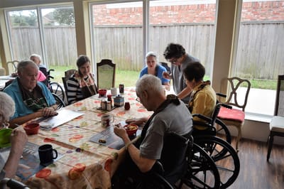 Residents enjoying a meal in a dining area