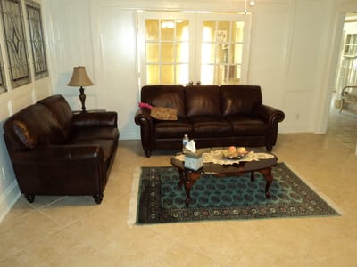 Cozy lounge area with brown couches and a coffee table