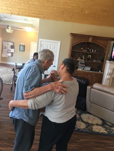 Residents engaging in a dance activity in a communal space