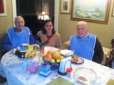 Residents enjoying a meal together at a dining table