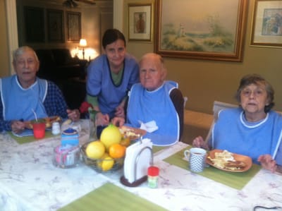 Residents enjoying a meal together in a cozy dining area