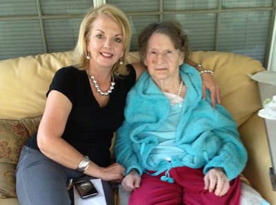 A woman with an elderly resident on a couch