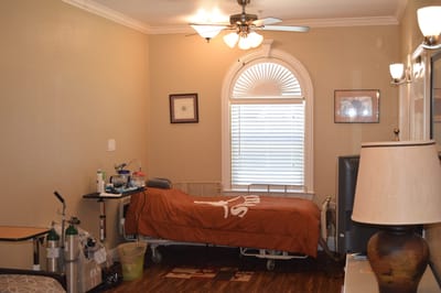 A private resident room with a hospital bed and furnishings