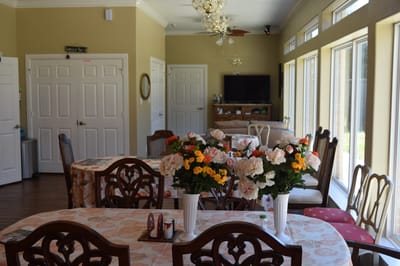 Bright dining area with floral centerpieces