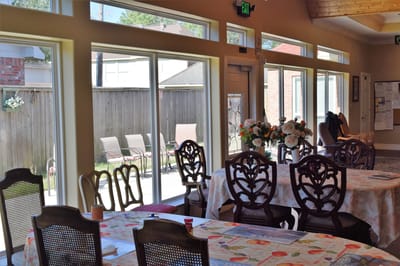 Bright common area with tables and outdoor view