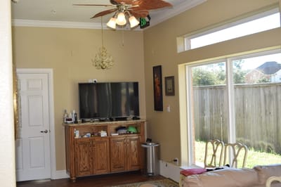 Bright interior space with seating and a television