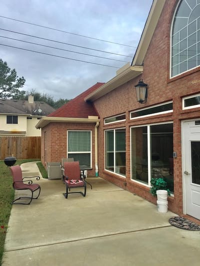 Outdoor patio area with seating and landscaping
