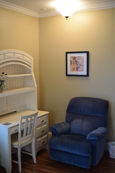 Cozy corner of a resident room with desk and chair