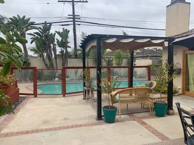 Outdoor patio area with pool and seating