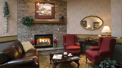Comfortable common area with a fireplace and seating.