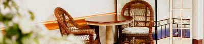 Cozy seating area with wicker chairs and a round table