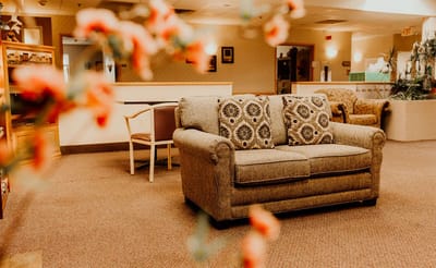 Cozy seating area in a shared common space with decor